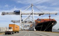 Crane Operators Move Shipping Containers