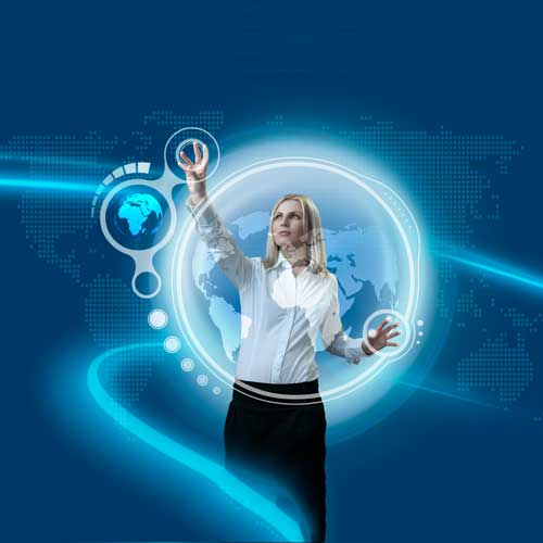 a standing woman using her hands to control the world using a futuristic computer