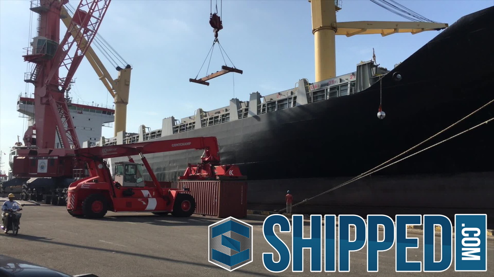 Shipped.com - Heavy duty forklift moving a fully loaded shipping container