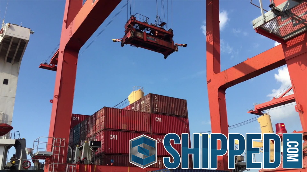 Shipped.com - Loading shipping containers onto a ship at the Cambodian port of Sihanoukville